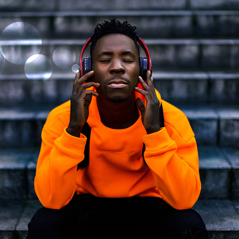 Man listening through headphones